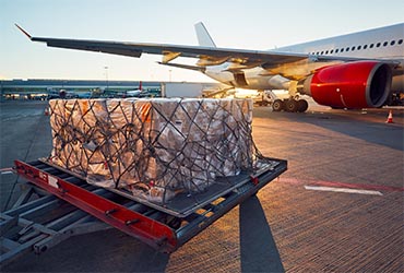 Air cargo beside an aircraft